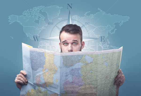 Young man holding map Stock photo © ra2studio