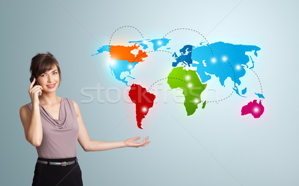 Stock photo: young woman making phone call with colorful world map