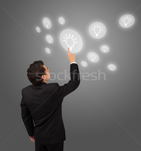 business man pressing touchscreen button  Stock photo © ra2studio