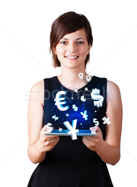 Młoda kobieta patrząc nowoczesne tabletka waluta ikona Zdjęcia stock © ra2studio