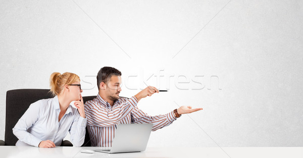 Businessman and businesswoman with plain white copy space Stock photo © ra2studio