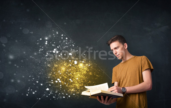 Jonge vent lezing magisch boek Blackboard Stockfoto © ra2studio