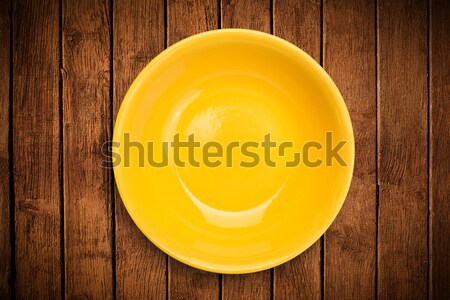 Colorful empty plate on grungy background table  Stock photo © ra2studio