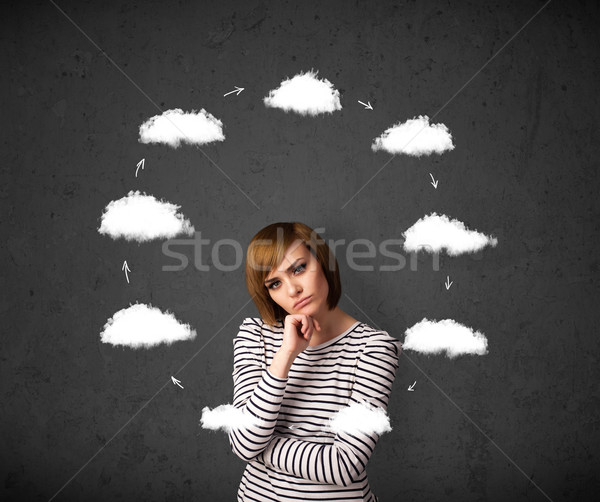 Young woman thinking with cloud circulation around her head Stock photo © ra2studio