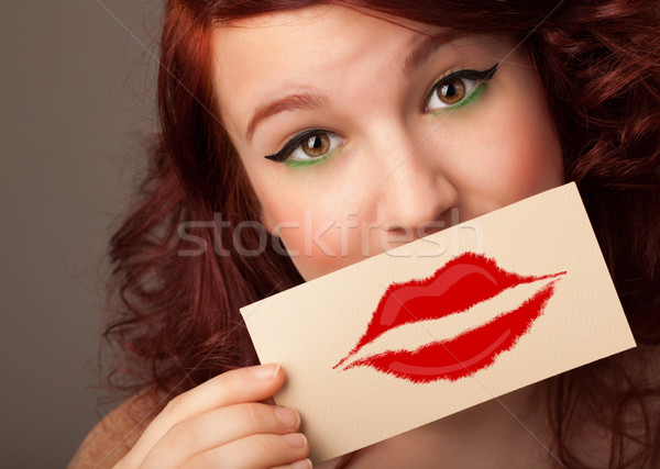 Heureux jolie femme carte baiser rouge à lèvres [[stock_photo]] © ra2studio