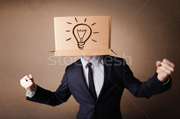 Biznesmen karton głowie stałego żarówka Zdjęcia stock © ra2studio
