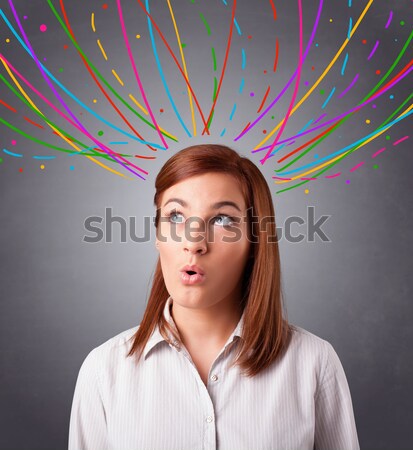 Young girl thinking with colorful abstract lines overhead Stock photo © ra2studio