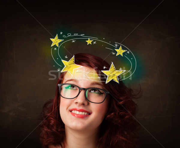 girl with yellow stars circleing around her head illustration Stock photo © ra2studio