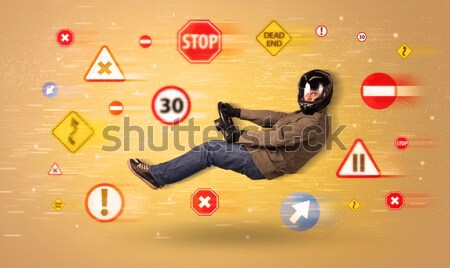 Young driver with road signs around him  Stock photo © ra2studio