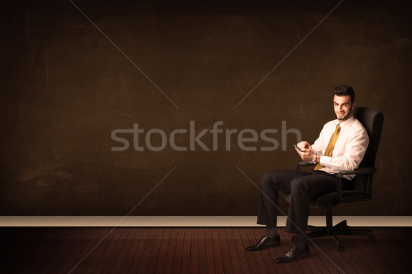Businessman holding high tech tablet on background with copyspac Stock photo © ra2studio