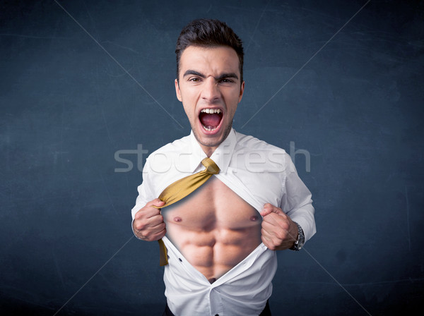 Businessman tearing off shirt and showing mucular body Stock photo © ra2studio