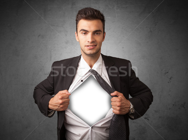 Businessman tearing off his shirt with white copyspace on chest Stock photo © ra2studio