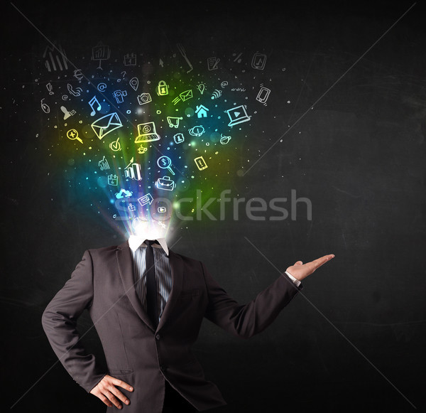 Business man with glowing media icons exploding head  Stock photo © ra2studio