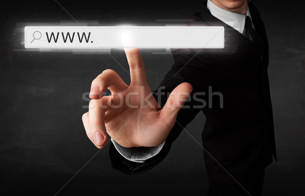 Fiatal üzletember megérint háló böngésző cím Stock fotó © ra2studio