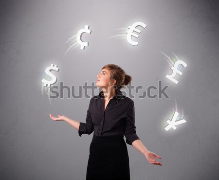  young lady standing and juggling with currency icons Stock photo © ra2studio