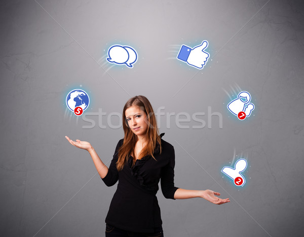 Séduisant jeune femme jonglerie réseau social icônes permanent [[stock_photo]] © ra2studio