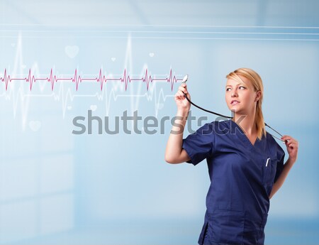 Pretty medical doktor listening to red pulse and heart rates Stock photo © ra2studio