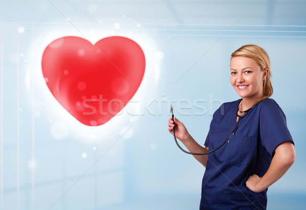 Foto stock: Jovem · enfermeira · cura · vermelho · coração · bastante