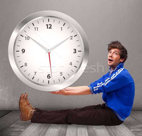 Attractive boy holding a huge clock Stock photo © ra2studio