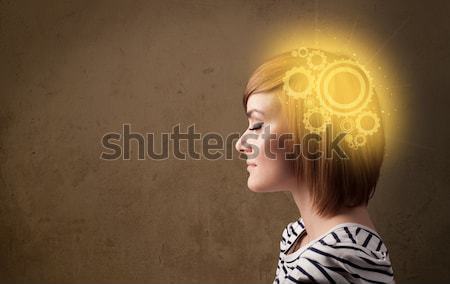 Young girl thinking with glowing brain illustration Stock photo © ra2studio