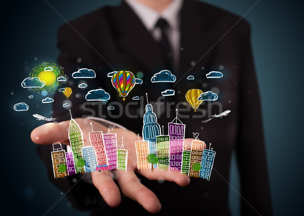 Young businessman presenting colorful hand drawn metropolitan ci Stock photo © ra2studio