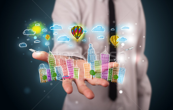 Young businessman presenting colorful hand drawn metropolitan ci Stock photo © ra2studio