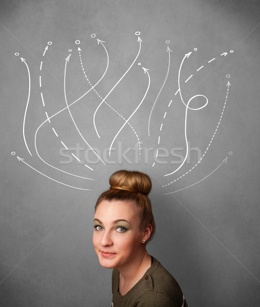 Young woman with arrows coming out of her head Stock photo © ra2studio