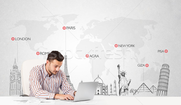 Businessman with world map and major landmarks of the world Stock photo © ra2studio