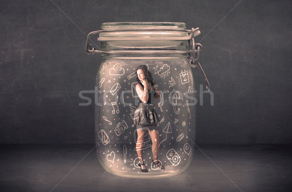 Business woman captured in glass jar with hand drawn media icons Stock photo © ra2studio