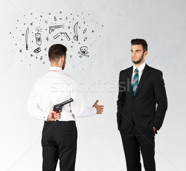Działalności biznesmen handshake ukrywanie broń symbolika Zdjęcia stock © ra2studio