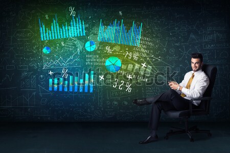 Businessman in office chair with tablet in hand and high tech gr Stock photo © ra2studio