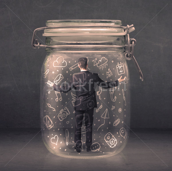 Business man captured in glass jar with hand drawn media icons c Stock photo © ra2studio