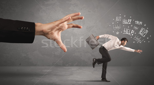 Business person running away from big hand  Stock photo © ra2studio