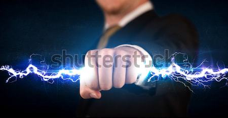 Homme d'affaires électricité lumière mains [[stock_photo]] © ra2studio