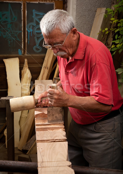 woodcarver working with mallet and chisel 3 Stock photo © ra2studio