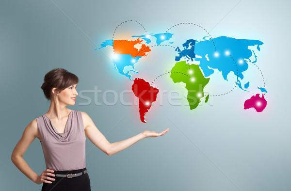 Young woman presenting colorful world map Stock photo © ra2studio