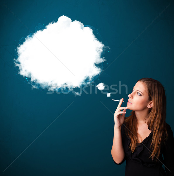 Young woman smoking unhealthy cigarette with dense smoke Stock photo © ra2studio