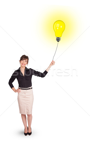 Heureux femme ampoule ballon jeune femme [[stock_photo]] © ra2studio