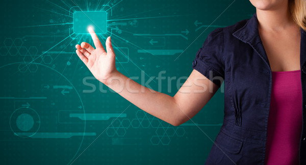 Stock photo: Woman pressing high tech type of modern buttons