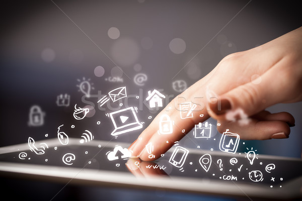 Finger pointing on tablet pc, social media concept Stock photo © ra2studio