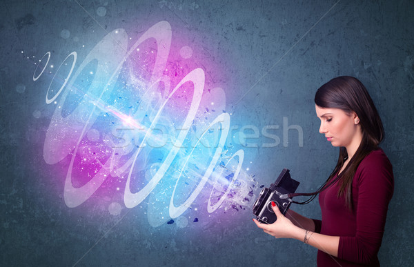 Stock photo: Photographer girl making photos with powerful light beam