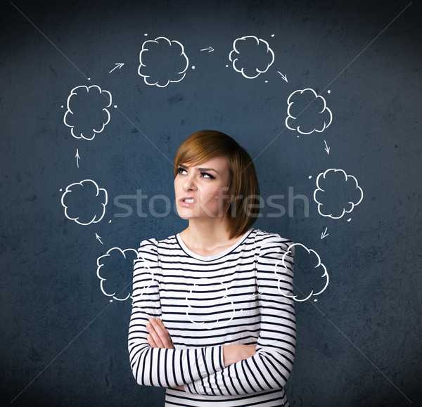Young woman thinking with cloud circulation around her head Stock photo © ra2studio