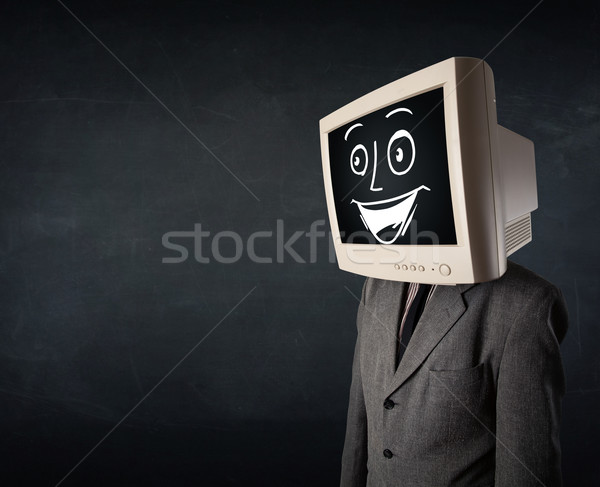 Happy businessman with a PC monitor head and a smiley face Stock photo © ra2studio