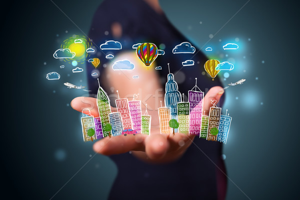 Stock photo: Young woman presenting colorful hand drawn metropolitan city