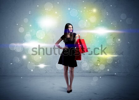 Stock photo: Mall lady with shopping bags and glitter light