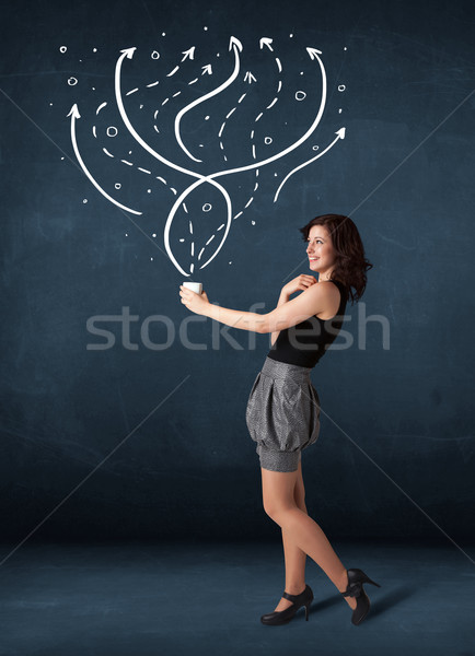 Businesswoman holding a white cup with lines and arrows Stock photo © ra2studio