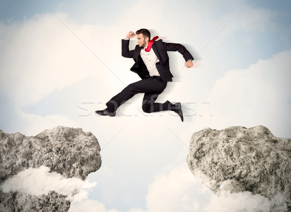 Glücklich Geschäftsmann springen Klippe Business Mann Stock foto © ra2studio