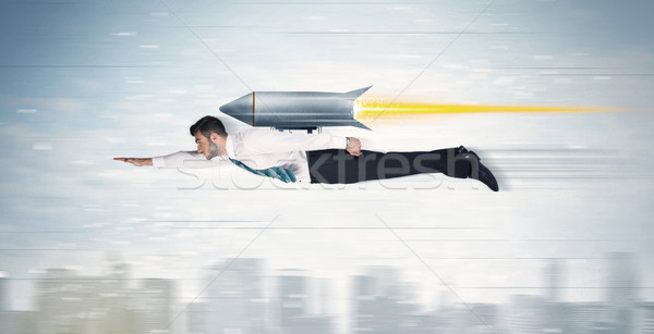 Süper kahraman iş adamı uçan jet paketlemek roket Stok fotoğraf © ra2studio