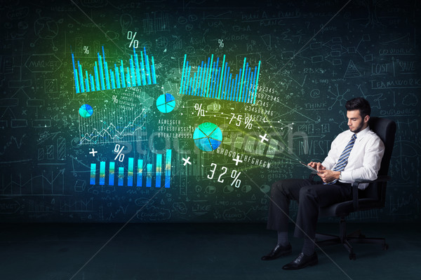 Businessman in office chair with tablet in hand and high tech gr Stock photo © ra2studio