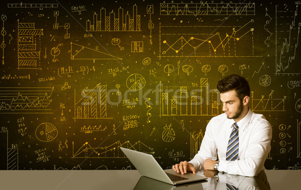 Businessman with diagram background Stock photo © ra2studio
